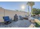 Outdoor patio with fire pit and seating area at 3121 E Hackamore St, Mesa, AZ 85213