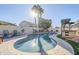 Sparkling pool with surrounding patio and landscaping at 3121 E Hackamore St, Mesa, AZ 85213