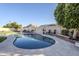 Large kidney shaped pool with patio and landscaping at 3121 E Hackamore St, Mesa, AZ 85213
