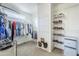 Spacious walk-in closet with shelving and hanging rods at 3121 E Hackamore St, Mesa, AZ 85213