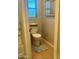 Small bathroom with toilet and updated flooring at 34696 N Barzona Trl, San Tan Valley, AZ 85143