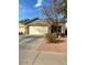 Single-story home with attached garage and landscaping at 34696 N Barzona Trl, San Tan Valley, AZ 85143