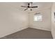 Spacious bedroom with ceiling fan and neutral wall colors at 350 N Westwood Rd, Mesa, AZ 85201