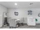 Bright dining area with white table and four gray chairs at 3926 E Captain Dreyfus Ave, Phoenix, AZ 85032