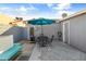 Relaxing patio with table, chairs, and bench at 3926 E Captain Dreyfus Ave, Phoenix, AZ 85032