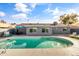 Relaxing kidney shaped pool with patio furniture at 3926 E Captain Dreyfus Ave, Phoenix, AZ 85032