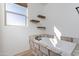 Bathroom with soaking tub, floating shelves, and wood-look tile flooring at 43512 N 16Th St, New River, AZ 85087