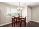 Bright dining room with table, four chairs, and chandelier at 4424 N 37Th Ave, Phoenix, AZ 85019