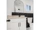 Modern bathroom with black and white vanity at 559 N Sirrine St, Mesa, AZ 85201