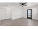 Bright and airy living room featuring wood-look flooring and ceiling fan at 559 N Sirrine St, Mesa, AZ 85201