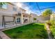 Large backyard with patio, basketball hoop, and grassy area at 6512 W Eagle Talon Trl, Phoenix, AZ 85083