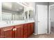 Double vanity bathroom with a large mirror and ample storage at 6512 W Eagle Talon Trl, Phoenix, AZ 85083