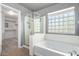Main bathroom with soaking tub, shower, and updated vanity at 6512 W Eagle Talon Trl, Phoenix, AZ 85083