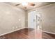 Bright bedroom featuring wood floors and a barn door at 6512 W Eagle Talon Trl, Phoenix, AZ 85083