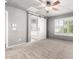 Bright bedroom with ceiling fan, barn door, and en-suite bathroom at 6512 W Eagle Talon Trl, Phoenix, AZ 85083