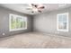 Well-lit bedroom with plantation shutters and ceiling fan at 6512 W Eagle Talon Trl, Phoenix, AZ 85083