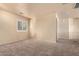 Spacious bedroom with neutral walls and carpeted floors at 6512 W Eagle Talon Trl, Phoenix, AZ 85083