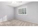Spacious bedroom with neutral walls and window shutters at 6512 W Eagle Talon Trl, Phoenix, AZ 85083