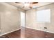 Simple bedroom with wood floors and window blinds at 6512 W Eagle Talon Trl, Phoenix, AZ 85083