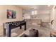 This loft style bonus room features a foosball table and additional seating at 6512 W Eagle Talon Trl, Phoenix, AZ 85083
