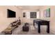 Fun bonus room with foosball table, TV, and cozy seating offers a versatile entertainment space at 6512 W Eagle Talon Trl, Phoenix, AZ 85083