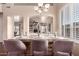Elegantly set dining room with stylish chairs and ample natural light, ideal for intimate meals and gatherings at 6512 W Eagle Talon Trl, Phoenix, AZ 85083
