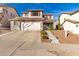 Two-story house with a two-car garage and landscaped yard at 6512 W Eagle Talon Trl, Phoenix, AZ 85083