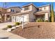 Two-story house with a two-car garage and landscaped yard at 6512 W Eagle Talon Trl, Phoenix, AZ 85083