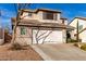 Two-story house with a two-car garage and mature tree at 6512 W Eagle Talon Trl, Phoenix, AZ 85083