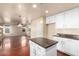 Open kitchen with island, hardwood floors, and breakfast area at 6512 W Eagle Talon Trl, Phoenix, AZ 85083