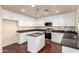 Modern kitchen with stainless steel appliances and an island at 6512 W Eagle Talon Trl, Phoenix, AZ 85083