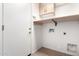 Bright laundry room with built-in cabinets and shelving at 6512 W Eagle Talon Trl, Phoenix, AZ 85083
