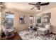 Bright living room featuring modern decor, stylish seating, and ample natural light, perfect for relaxation and entertaining guests at 6512 W Eagle Talon Trl, Phoenix, AZ 85083