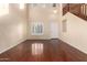 Bright living room with hardwood floors, high ceilings, and large windows at 6512 W Eagle Talon Trl, Phoenix, AZ 85083