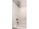 Clean shower-tub combo featuring chrome fixtures, white tub and wall surround at 6512 W Eagle Talon Trl, Phoenix, AZ 85083