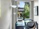 Home office featuring a desk, printer, and large window at 7131 E Rancho Vista Dr # 3002, Scottsdale, AZ 85251