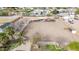 Aerial view of large lot with white fencing, mature trees and landscaping at 9120 E Dennis St, Mesa, AZ 85207