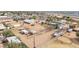Aerial view of a large residential lot featuring multiple outbuildings and white fencing at 9120 E Dennis St, Mesa, AZ 85207
