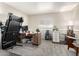 Bedroom featuring a large treadmill, desk, and window providing natural light at 9120 E Dennis St, Mesa, AZ 85207