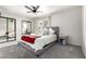 This cozy bedroom features a comfortable bed, a ceiling fan, and closet with mirrored sliding doors at 9120 E Dennis St, Mesa, AZ 85207