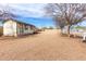 Exterior view of house with white fence and large dirt area at 9120 E Dennis St, Mesa, AZ 85207