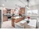 Bright eat-in kitchen features stainless steel appliances, granite countertops, and modern lighting at 9120 E Dennis St, Mesa, AZ 85207