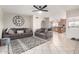 Comfortable living room with cozy seating, neutral tones, and adjacent eat-in kitchen area at 9120 E Dennis St, Mesa, AZ 85207