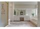 Bright bathroom featuring a dual sink vanity, large mirror, shower, and a soaking tub at 9338 E Cherrywood Dr, Sun Lakes, AZ 85248