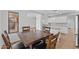 Dining area with square wooden table and kitchen access at 9405 W Coolidge St, Phoenix, AZ 85037