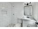 Clean bathroom with white subway tile and modern vanity at 10001 N 87Th Ln, Peoria, AZ 85345