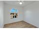 Bright bedroom with wood floors and arched window at 10001 N 87Th Ln, Peoria, AZ 85345