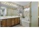 Bathroom with double vanity and bathtub at 10048 E Emerald Dr, Sun Lakes, AZ 85248