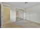 Guest bedroom with mirrored closet doors at 10048 E Emerald Dr, Sun Lakes, AZ 85248