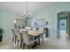 Elegant dining room featuring a large wooden table and chandelier at 10048 E Emerald Dr, Sun Lakes, AZ 85248